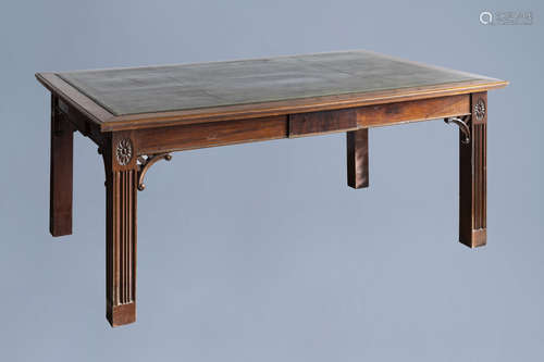 An English George II mahogany library table with a gilt tool...