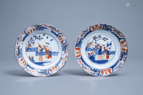 A pair of Chinese Imari style plates with figures in a garde...