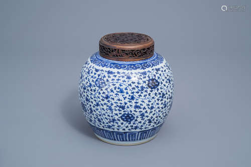 A Chinese blue and white 'lotus scroll' jar with wooden cove...