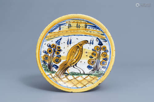 A polychrome Spanish maiolica charger with a bird among flow...