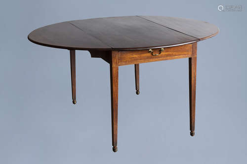 A George III mahogany drop-leaf pembroke table with a drawer...