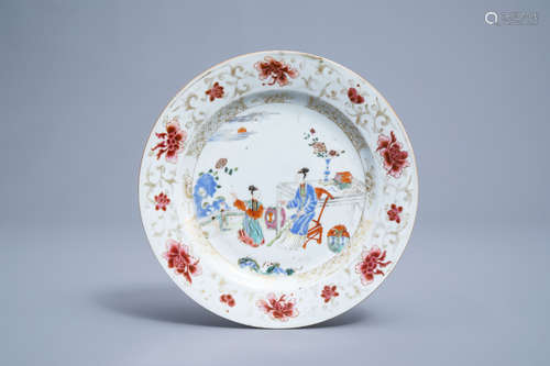 A Chinese famille rose and gilt plate with ladies on a terra...