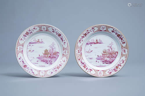 A pair of Chinese puce enamelled and gilt plates with a land...