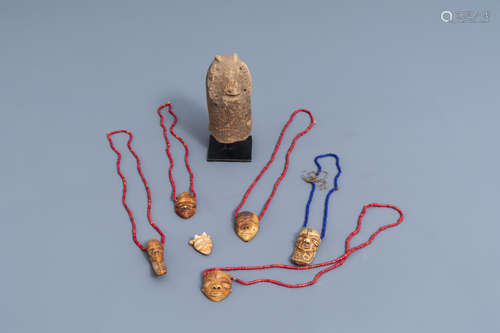 Six ivory Ikhoko pendants, Pende, Congo and a terracotta scu...