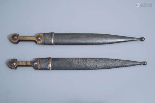 Two Caucasian 'kindjal' daggers with accompanying scabbard, ...