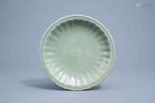 A lotus shaped Chinese Longquan celadon charger with undergl...