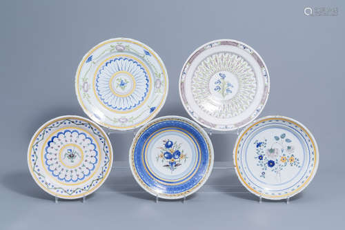 Five polychrome Brussels faience plates with floral design, ...