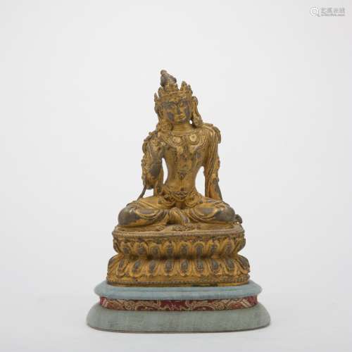 A gilt-bronze statue of Vajrasana hammer
