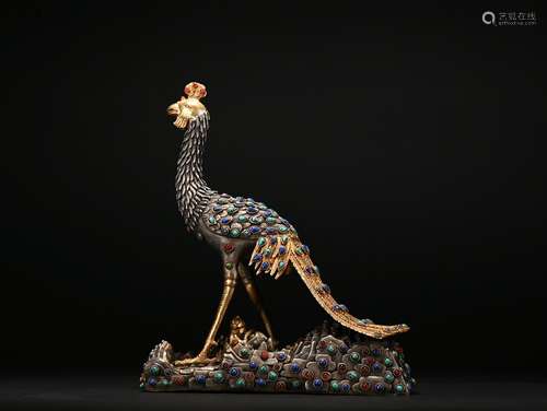 A gilt-bronze peacock