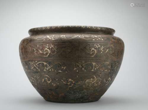 A bronze jar ware with gold and silver