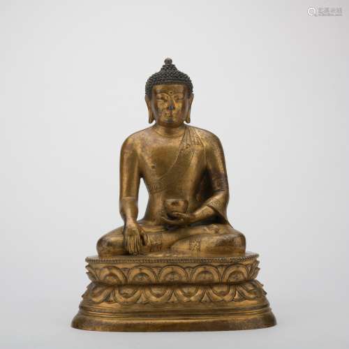A gilt-bronze statue of Pharmacist Buddha