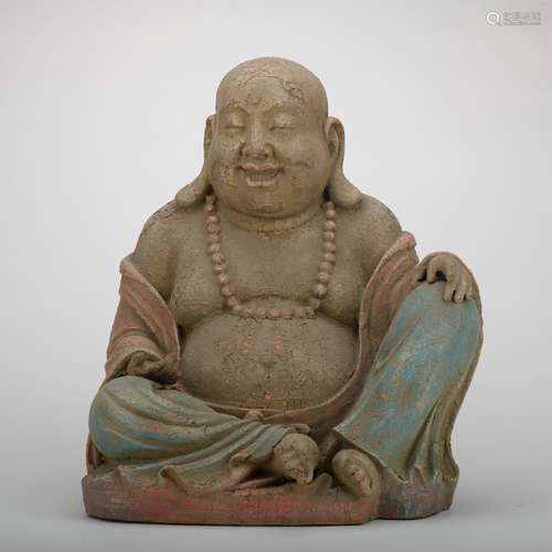 A wood statue of Maitreya Buddha