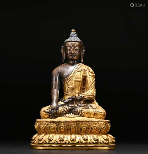 A gilt-bronze statue of Shakya Muni