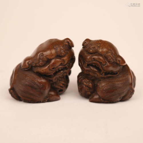 A pair of lions carved with bamboo roots, 19th century