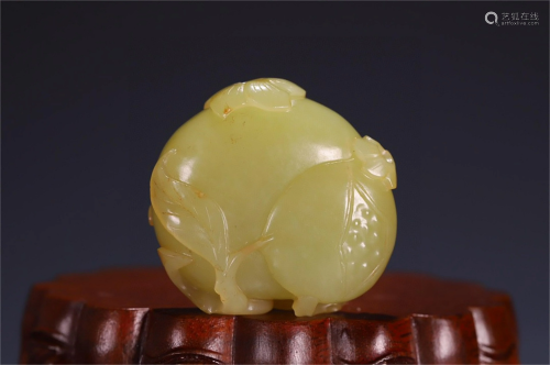 A Carved Yellow Jade Pomegranate