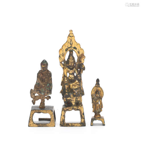 THREE SMALL GILT BRONZE BUDDHIST FIGURES Tang Dynasty or lat...