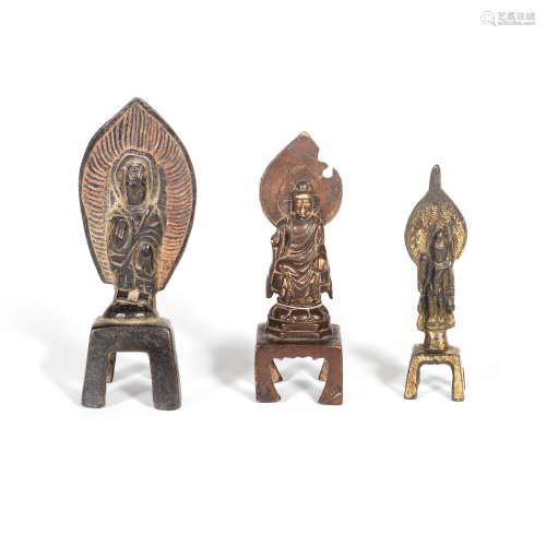 A GROUP OF THREE NORTHERN WEI-STYLE BRONZE FIGURES OF BUDDHA...