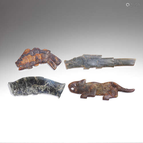 A GROUP OF ARCHAIC JADE ZOOMPORPHIC PENDANTS Western Zhou Dy...