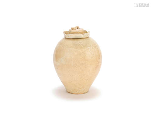 A CARVED CREAM-GLAZED JAR AND COVER Song Dynasty