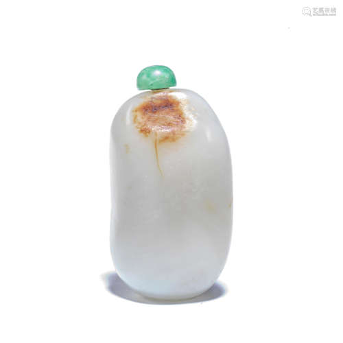 A PALE GREEN AND RUSSET JADE 'PEBBLE' SNUFF BOTTLE Late Qing...
