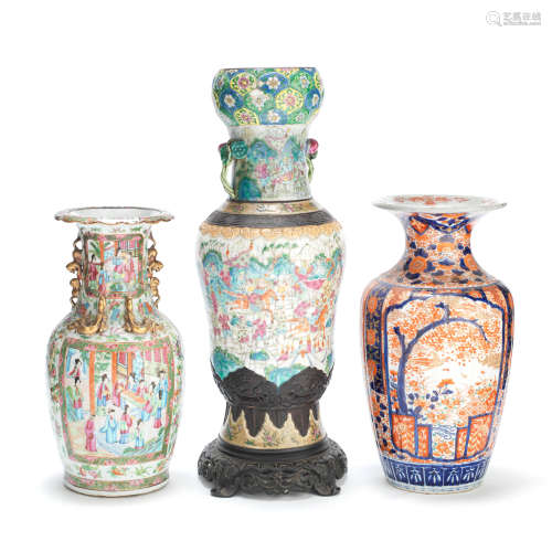 TWO CANTON FAMILLE ROSE VASES AND AN IMARI VASE 19th century