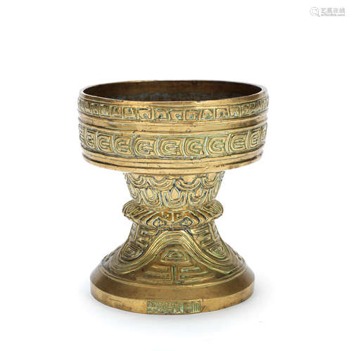 A BRONZE ARCHAISTIC STEM BOWL, DOU Qianlong six-character se...