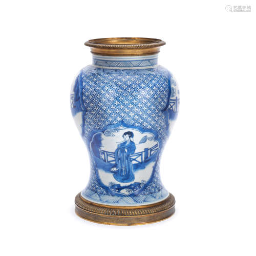 A GILT METAL-MOUNTED BLUE AND WHITE BALUSTER VASE The porcel...