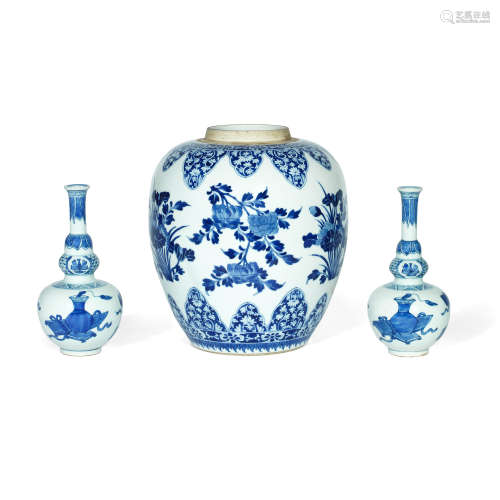 A BLUE AND WHITE FLORAL JAR AND A PAIR OF TRIPLE GOURD VASES...