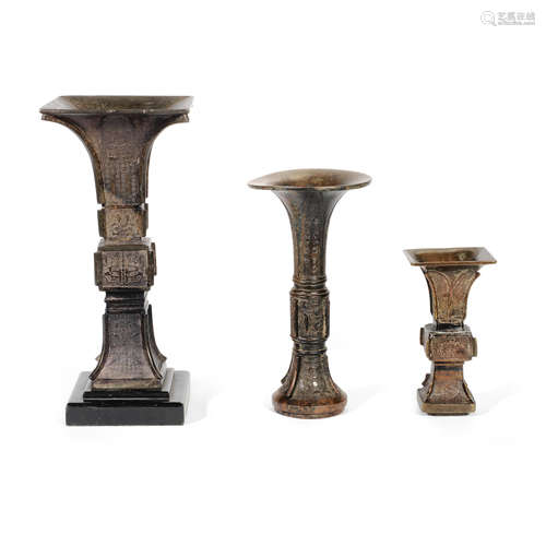 THREE ARCHAISTIC BRONZE BEAKER VASES, GU Ming/early Qing Dyn...