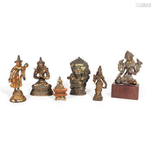 A SELECTION OF SIX VARIOUSLY BRONZE AND GILT BRONZE BUDDHIST...