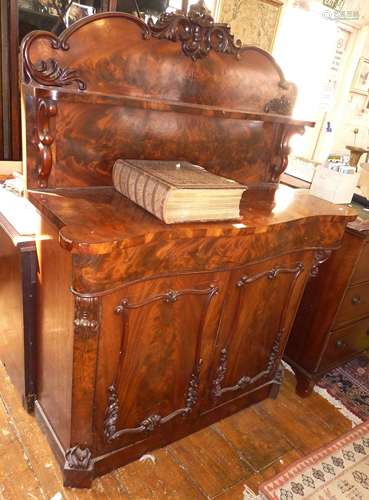 Victorian flame mahogany serpentine top chiffonier, with car...