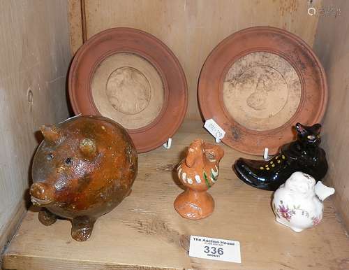 Glazed earthenware pig, terracotta bird whistle, pair of rou...