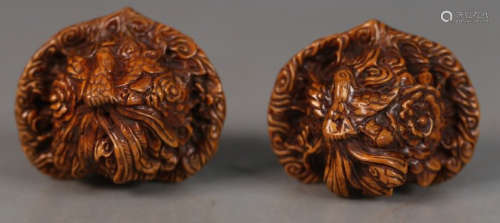 PAIR OF WALNUT CARVED PENDANT