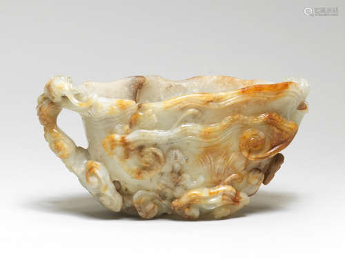 A RARE LARGE PALE GREEN AND RUSSET JADE 'LINGZHI AND CHILONG...