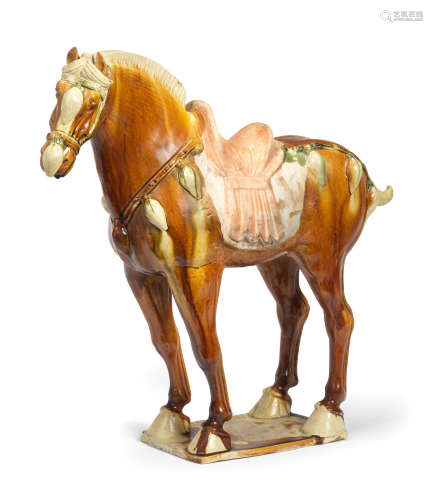A FINE SANCAI-GLAZED POTTERY MODEL OF A HORSE Tang Dynasty