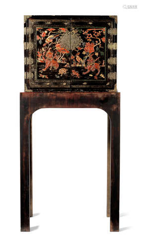 A BLACK LACQUERED GILT AND POLYCHROME-DECORATED CABINET Late...