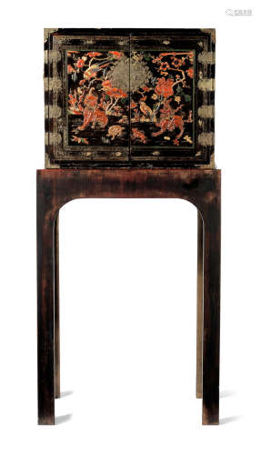 A BLACK LACQUERED GILT AND POLYCHROME-DECORATED CABINET Late...