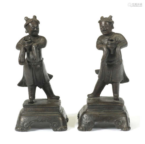 A PAIR OF BRONZE FIGURES OF MALE ATTENDANTS Ming Dynasty