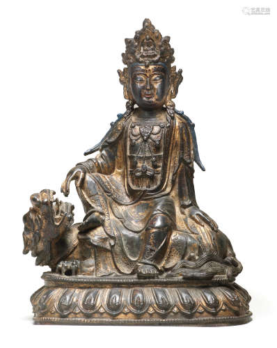 A LARGE GILT-LACQUERED BRONZE FIGURE OF GUANYIN ON A LION Mi...