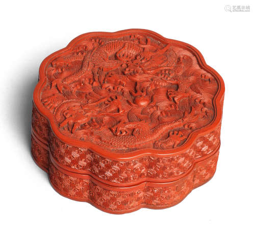 A CARVED CINNABAR LACQUER 'DRAGONS AND WAVES' BOX AND COVER ...