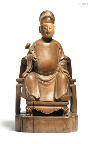 A RARE BOXWOOD SEATED FIGURE OF GU ZHENGUAN Late 17th/18th c...