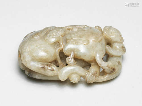 A RARE GREYISH JADE CARVING OF A MYTHICAL BEAST AND YOUNG 16...