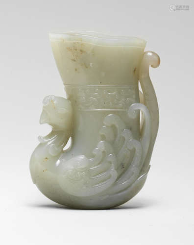 A PALE GREEN JADE 'PHOENIX' RHYTON CUP 17th/18th century