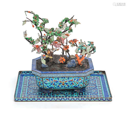 A HARDSTONE AND CORAL TREE IN A PAINTED-ENAMEL JARDINIÈRE 18...