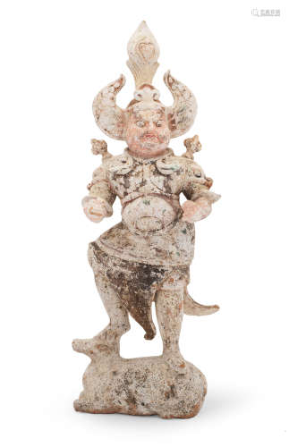 A LARGE PAINTED POTTERY FIGURE OF A LOKAPALA Tang Dynasty