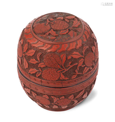 A CARVED CINNABAR LACQUER OVIFORM 'LYCHEE' BOX AND COVER 16t...