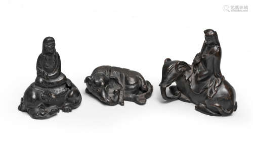 THREE BRONZE SCROLL WEIGHTS 16th/17th century