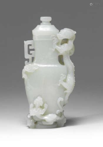 A RARE VERY PALE GREEN JADE 'DRAGON AND YOUNG' VASE AND COVE...