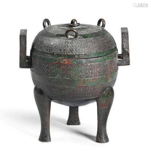 AN ARCHAISTIC BRONZE RITUAL FOOD VESSEL AND COVER, DING Ming...