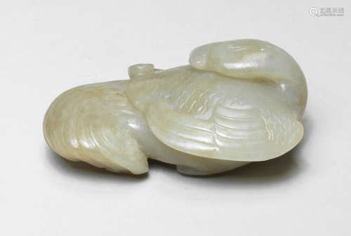 A PALE GREEN JADE CARVING OF A PHOENIX Ming Dynasty